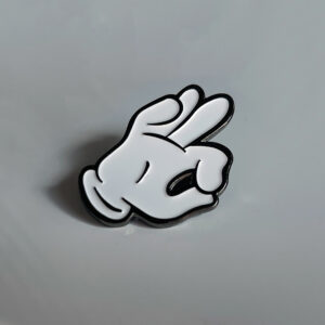 Cartoon Hand lapel pin.