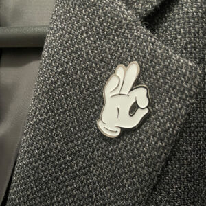 Cartoon Hand lapel pin.