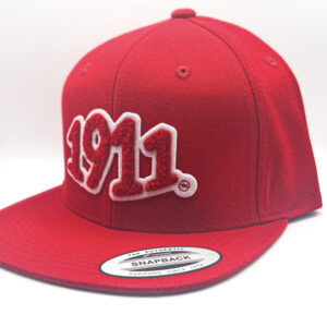 1911 chenille patch on red snapback.